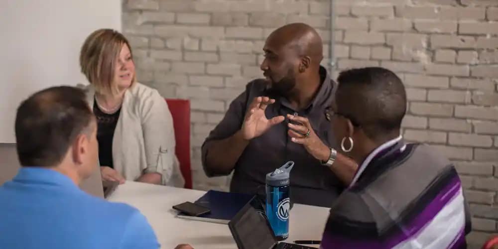 faculty talking together