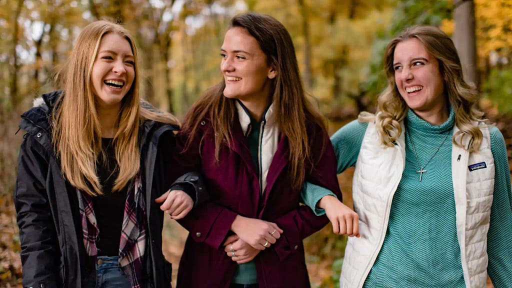 A group of happy students outside