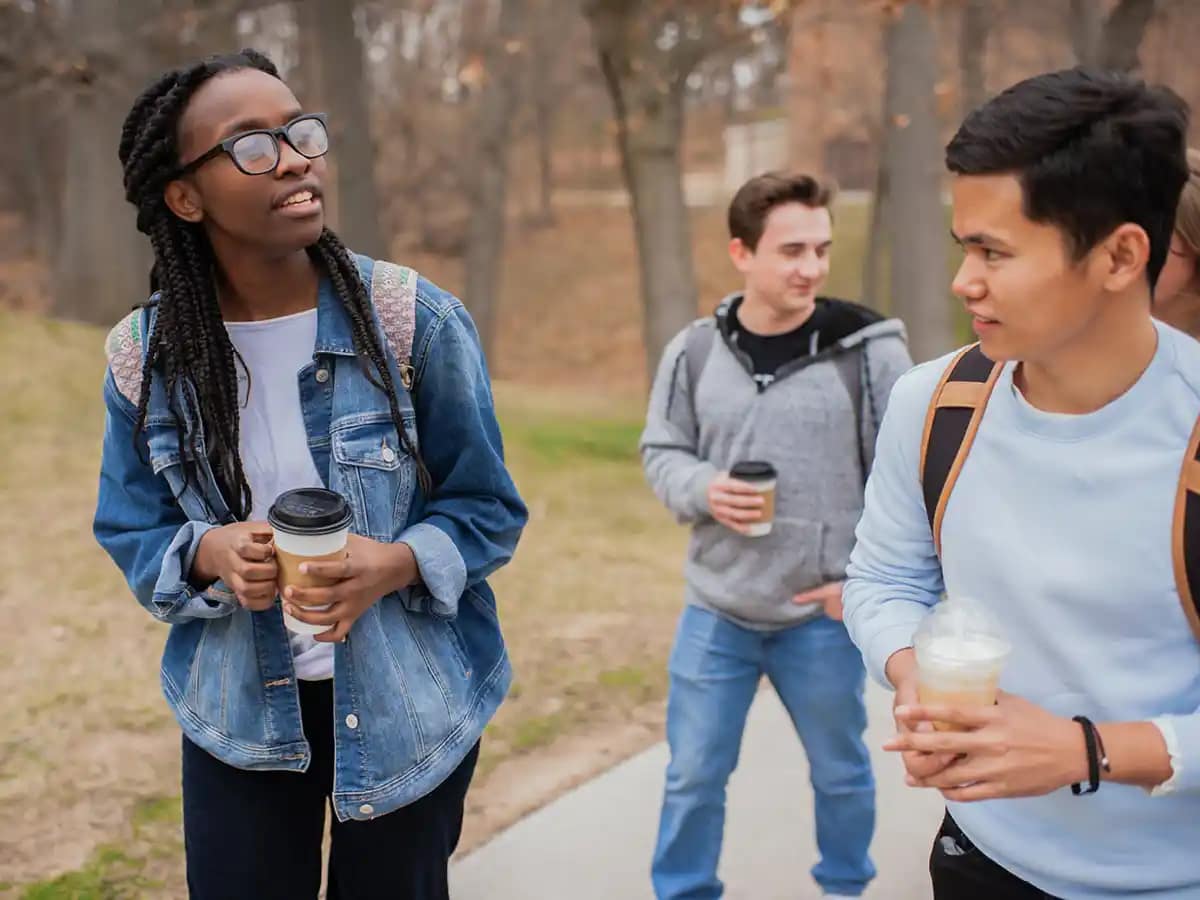 Visit-google-images5 A man standing in front of a group of people in a classroom