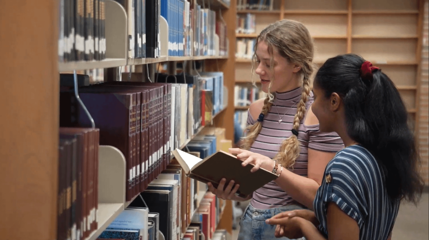 Students-Looking-At-Books