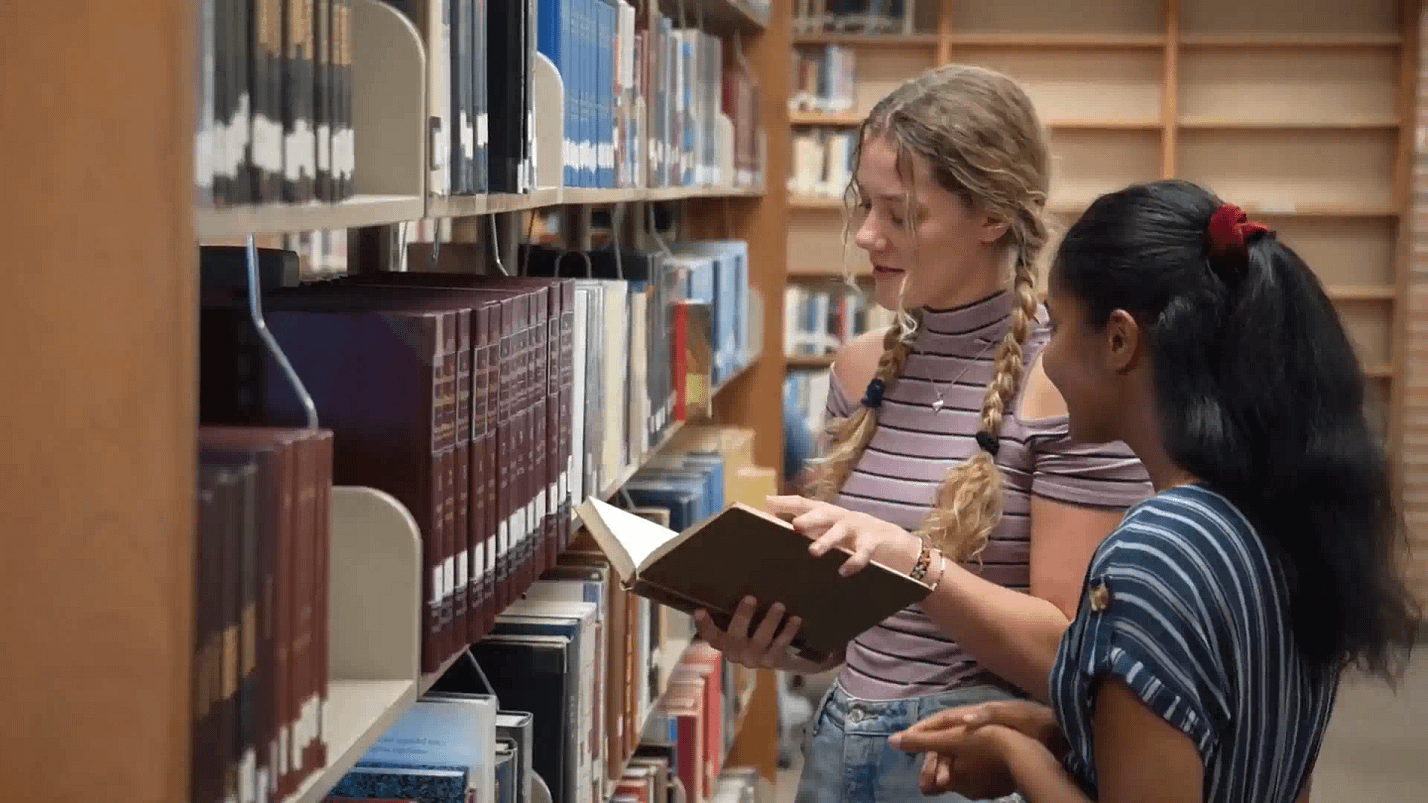 Students-Looking-At-Books