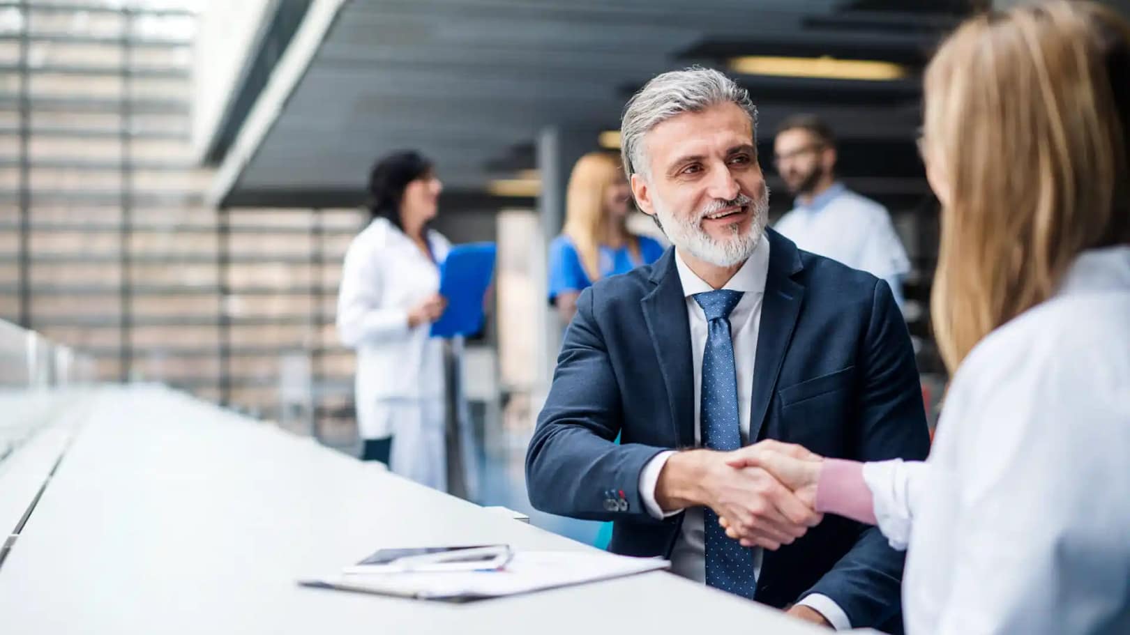 Two business people shaking hands