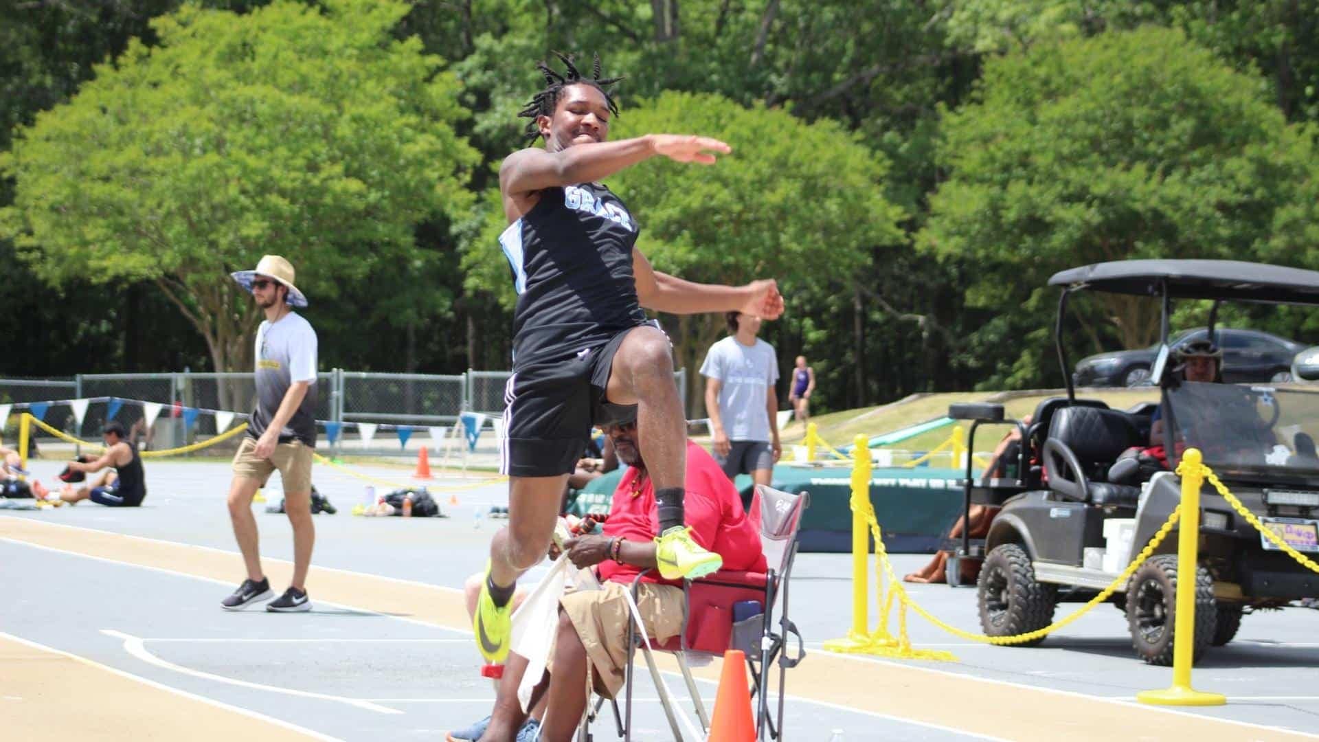 IMG_3266 athlete appears to be hurdling over a spectator