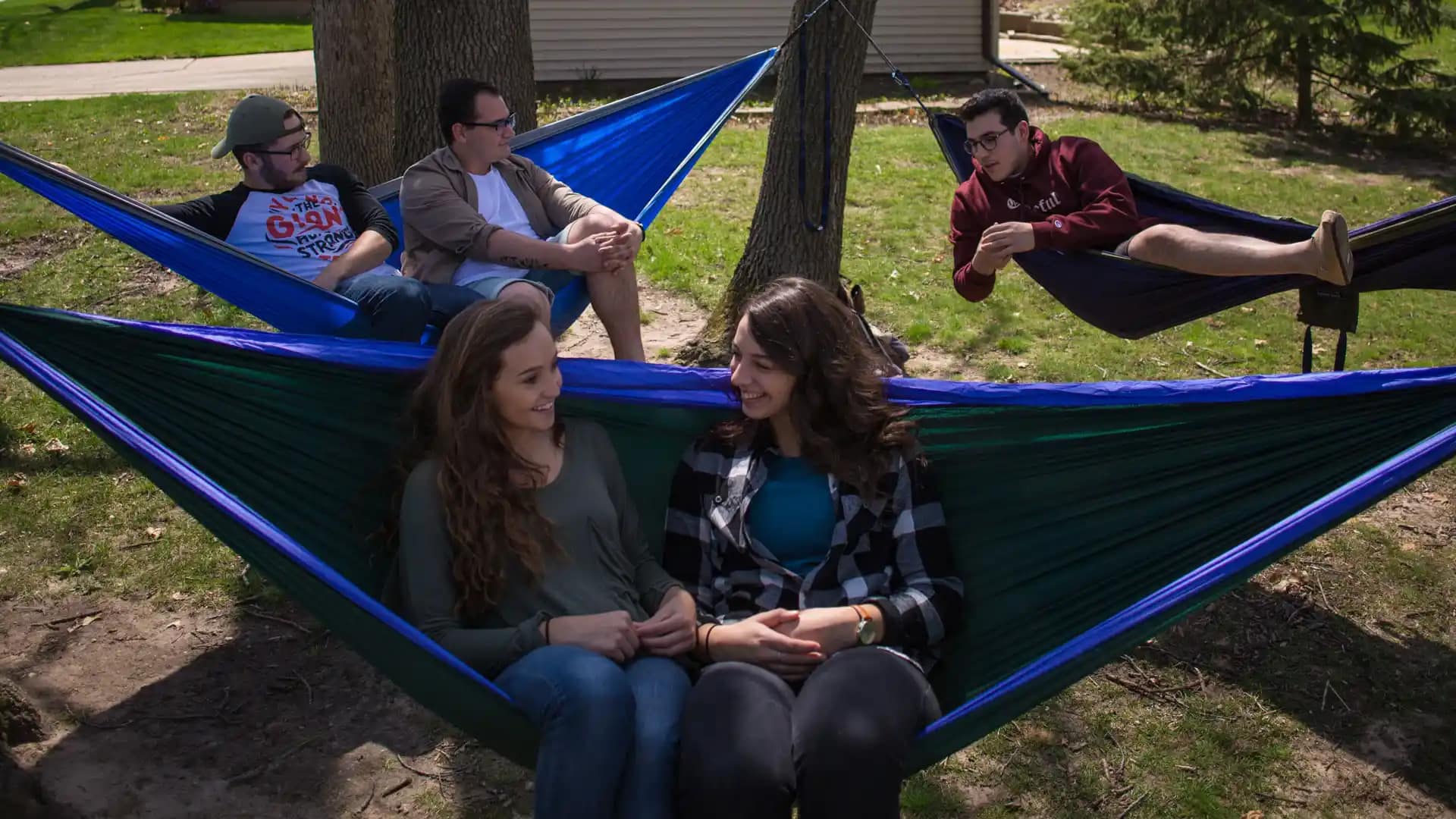 Summer-Camps Grace students in hammocks on campus