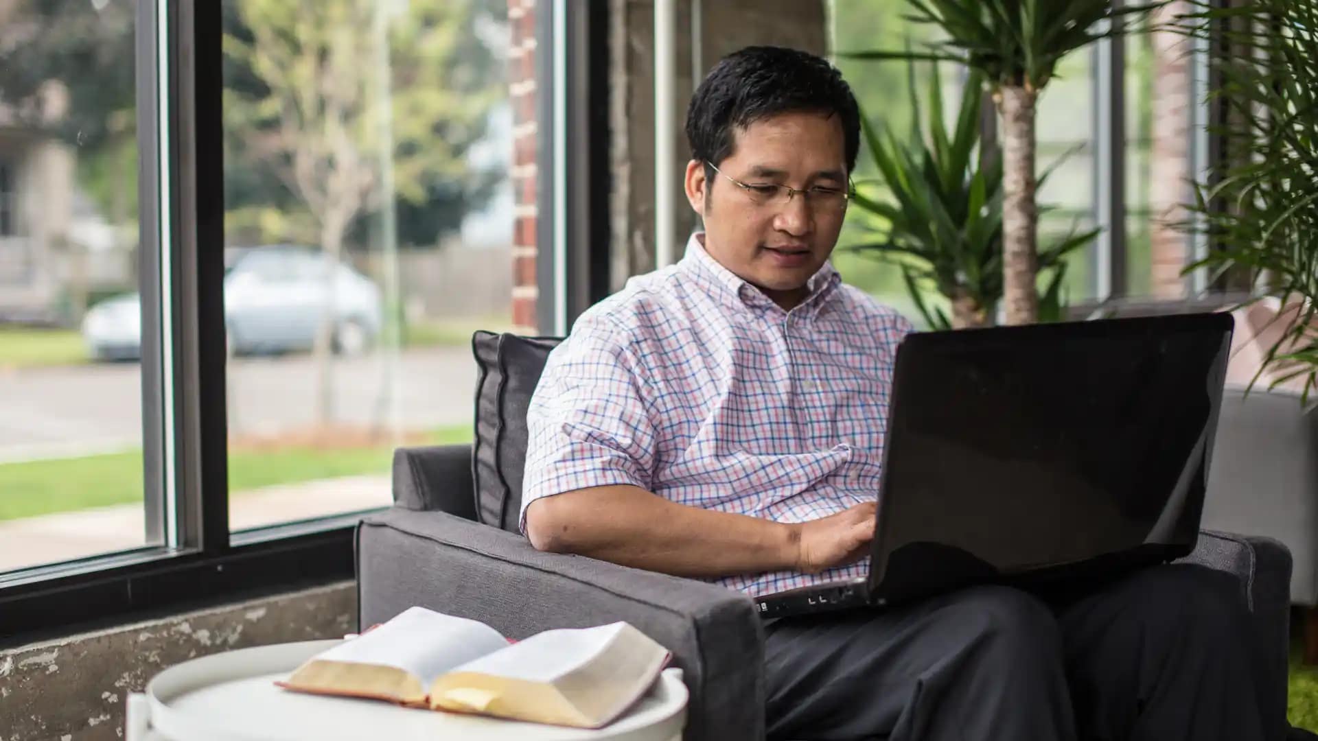Growth-Tracks Grace Student working on a laptop in a workspace.