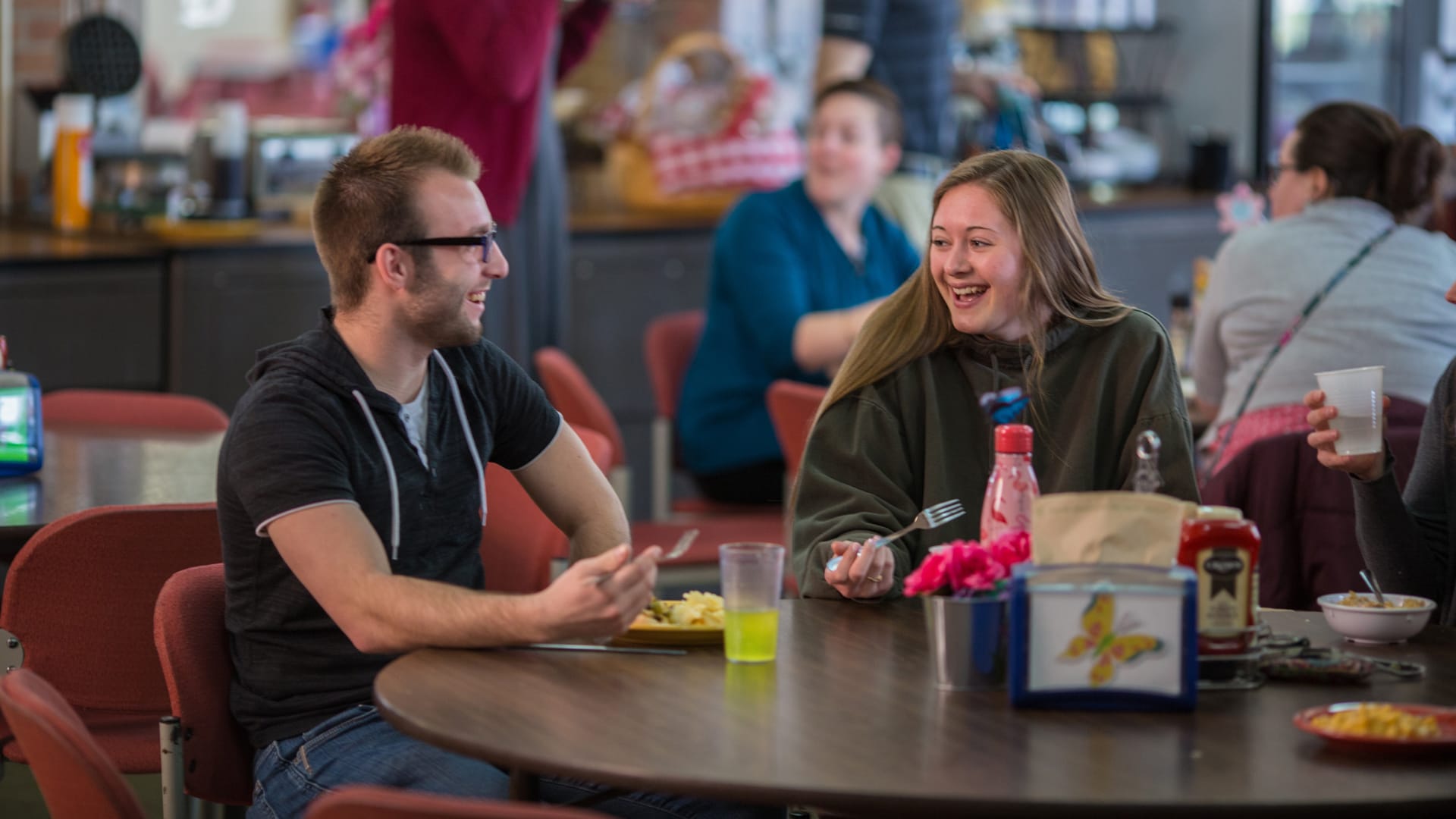 On-Campus-Students-Dining-Hall Grace students sitting around a table in the Dining Hall.