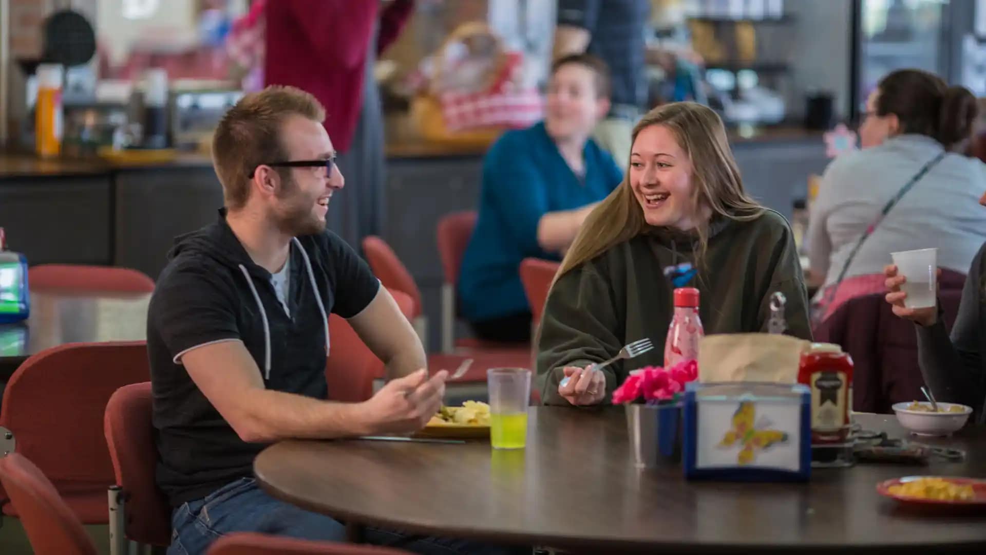 On-Campus-Students-Dining-Hall Grace students sitting around a table in the Dining Hall.