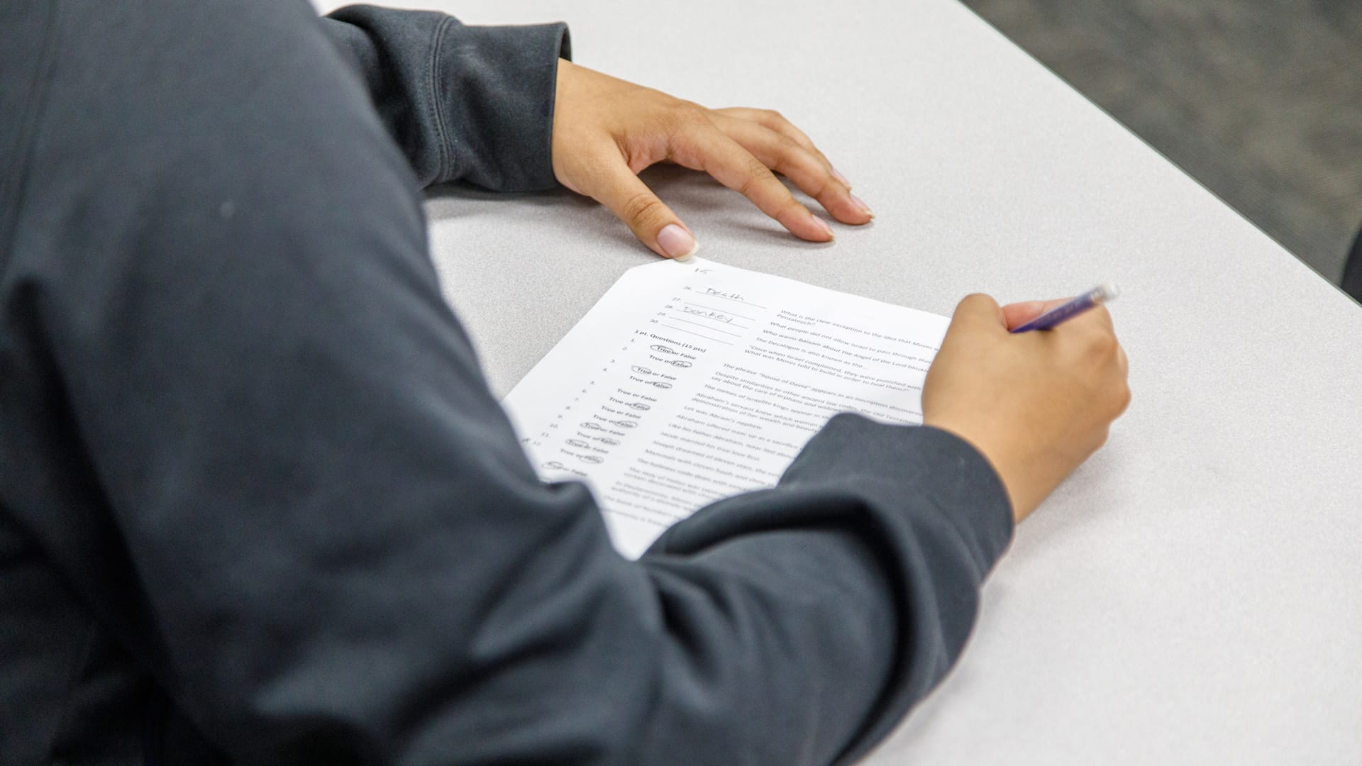 Refund-Policy Grace student filling out a form.