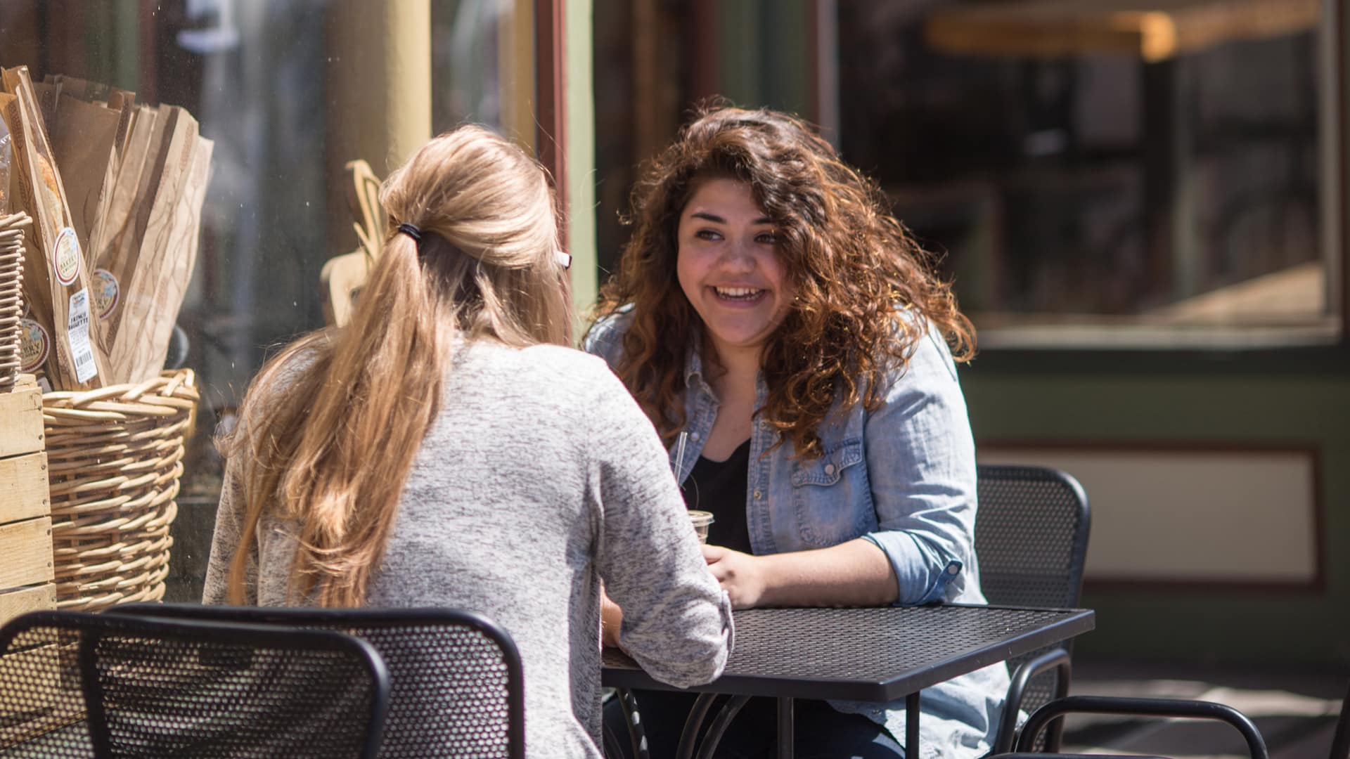 Student-Mentorship Two Grace students talking over coffee at a coffee shop as part of a Mentorship Program.