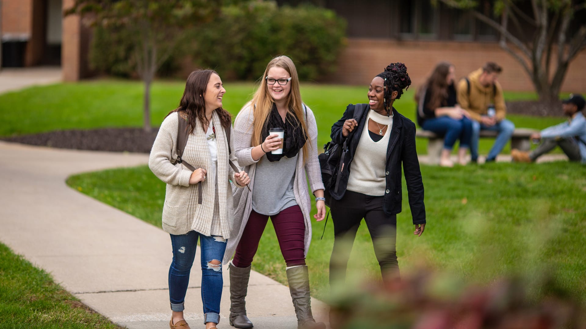 Student-Resources Happy Grace students walking around the beautiful Grace Christian University campus.