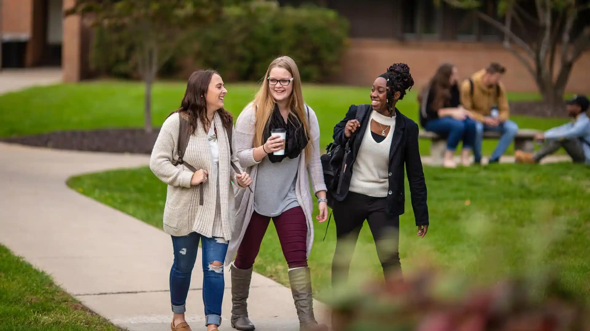 Student-Resources Happy Grace students walking around the beautiful Grace Christian University campus.