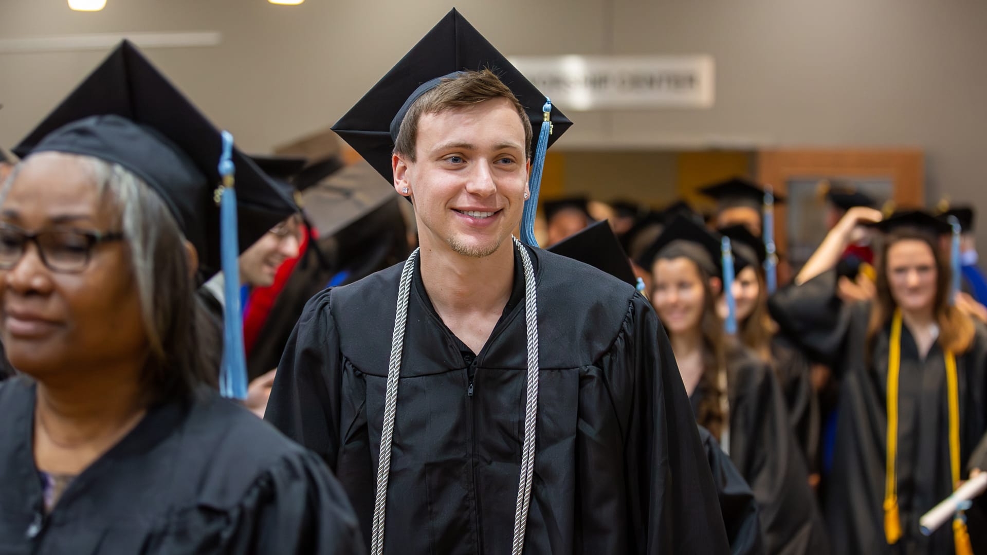 Transcript-Request Graduate of Grace Christian University in Cap and Gown