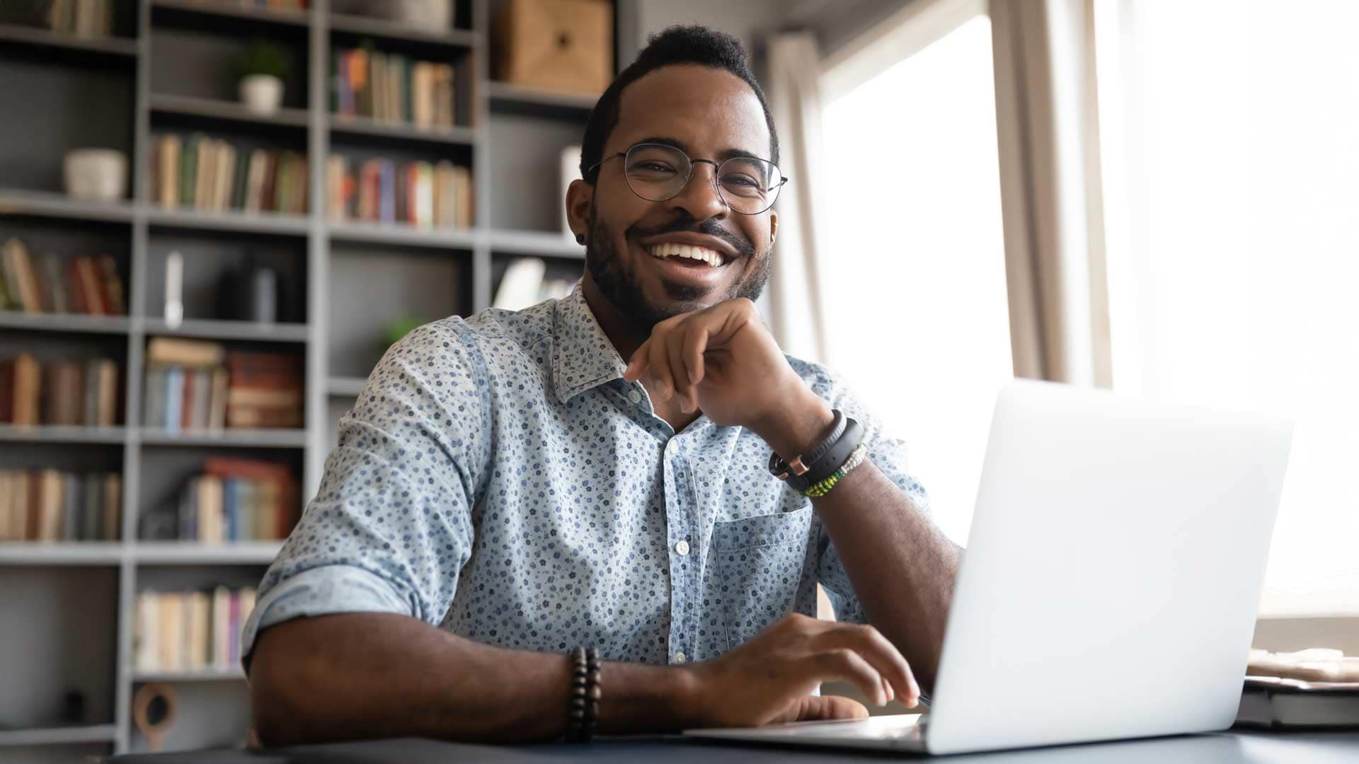Grace-Online-Student-2 A happy Grace Online student working on a laptop