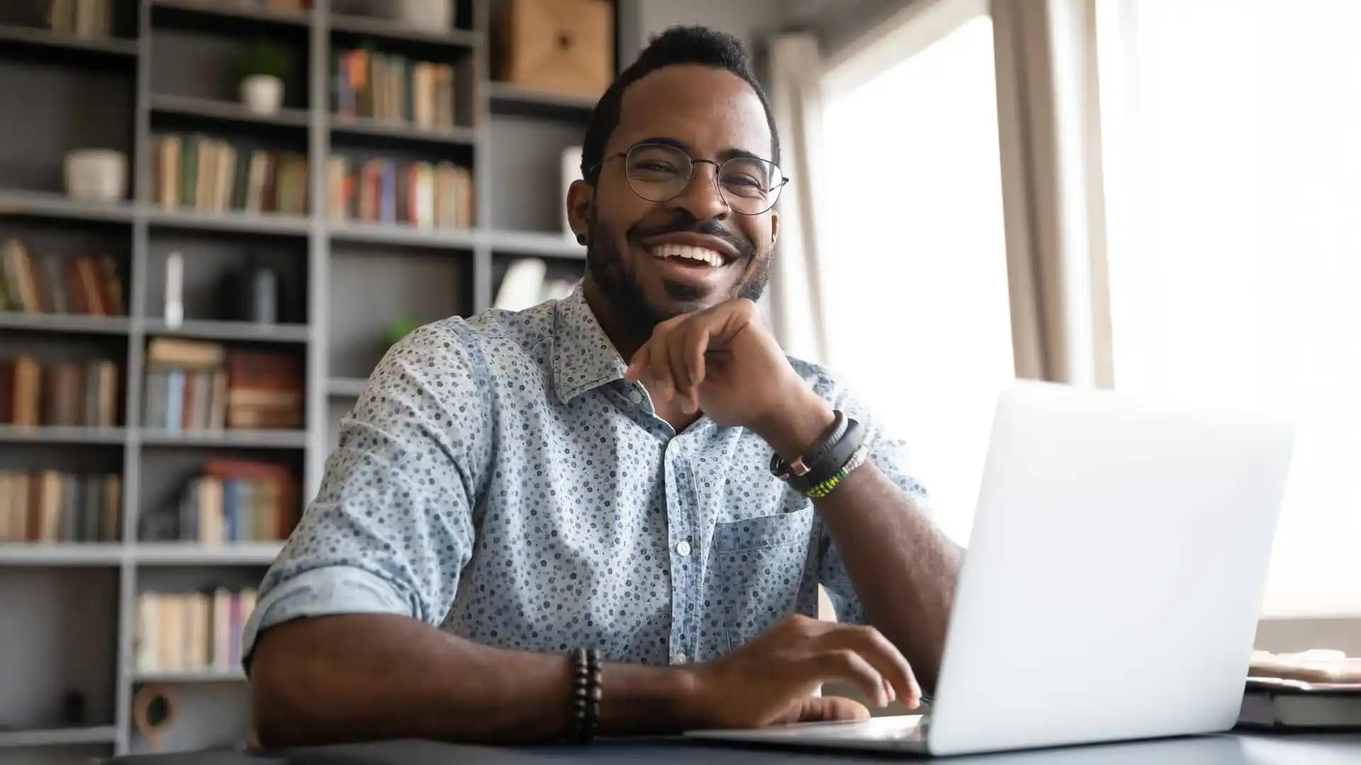 Grace-Online-Student-2 A happy Grace Online student working on a laptop