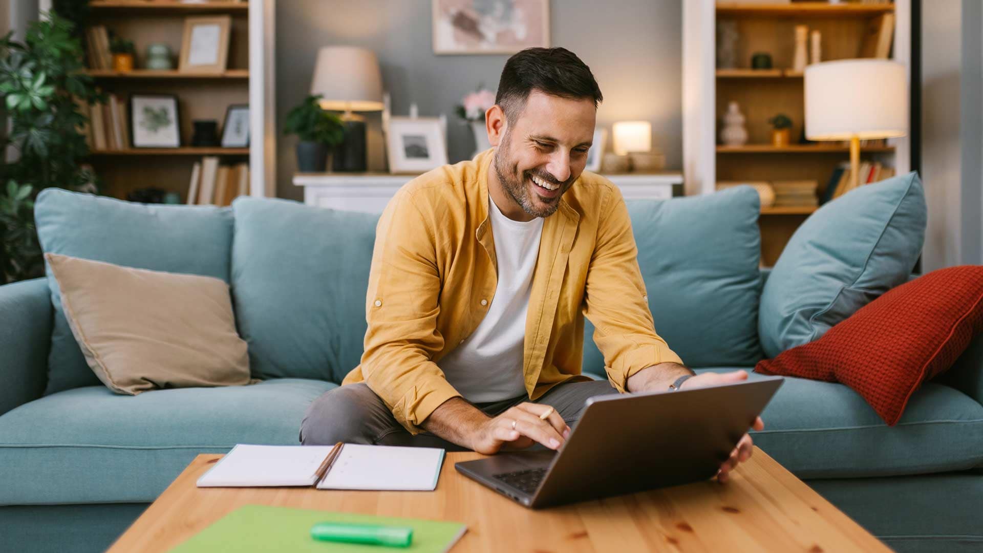 Grace-Online-Student-Laptop Happy Grace Online student working on a laptop in their living room