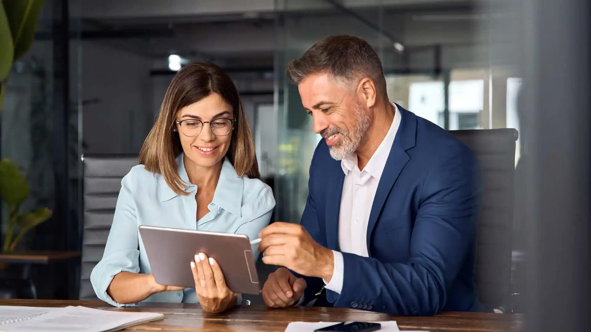 Grace-Online-Students-Laptop Grace Online Graduate students in a workspace working on a tablet