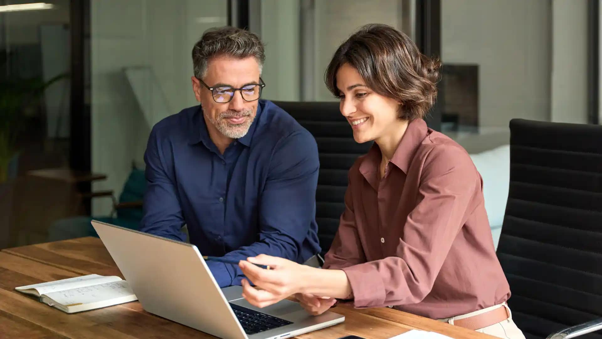 Online-Students-Office Grace Online students working in an office space on a laptop