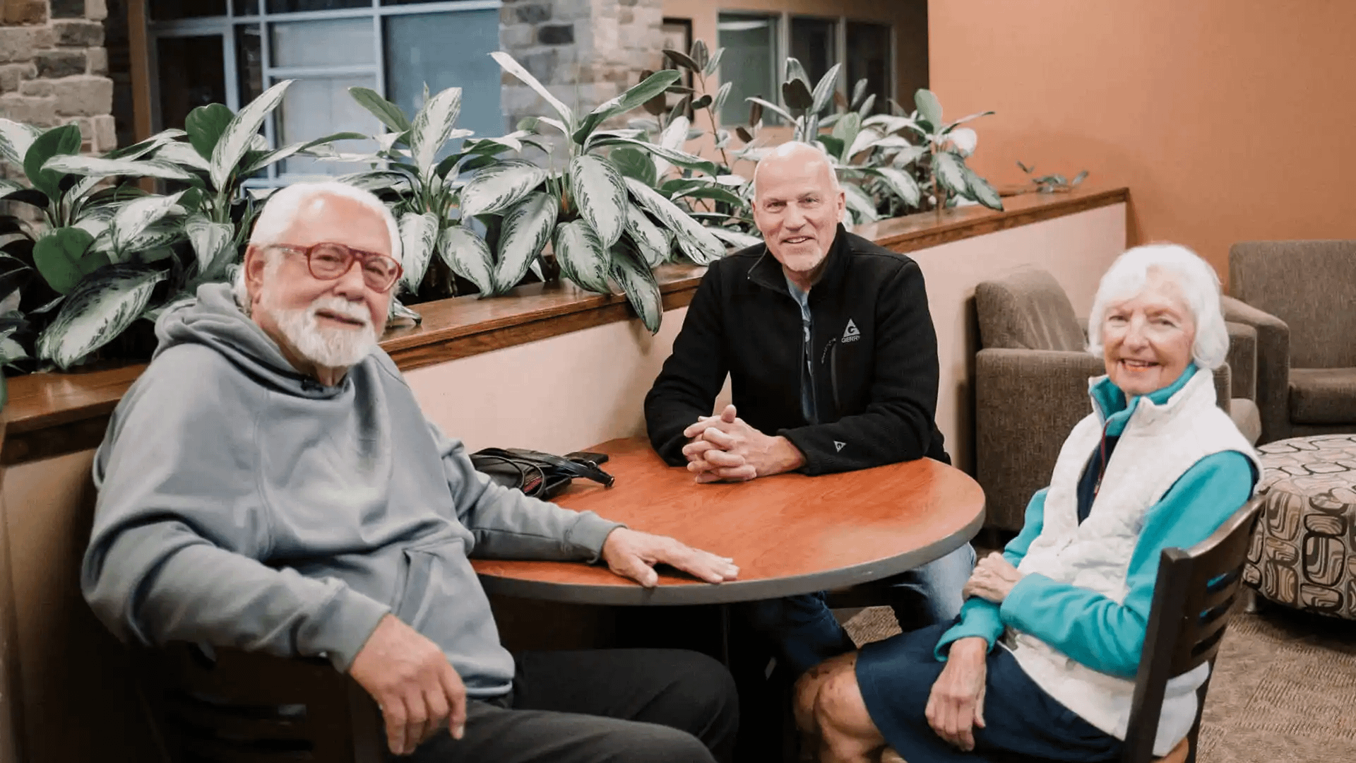 Share-Your-Story A group of Grace alumni sitting around a table in the Commons