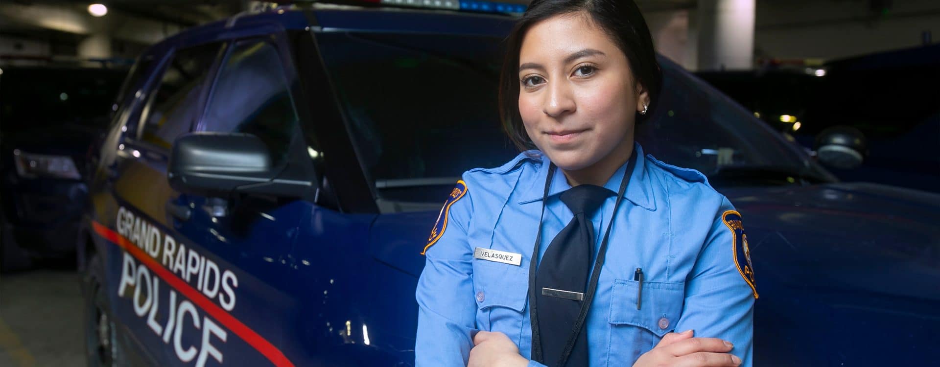 Journey-webheader-ServingHope police officer in front of cruiser