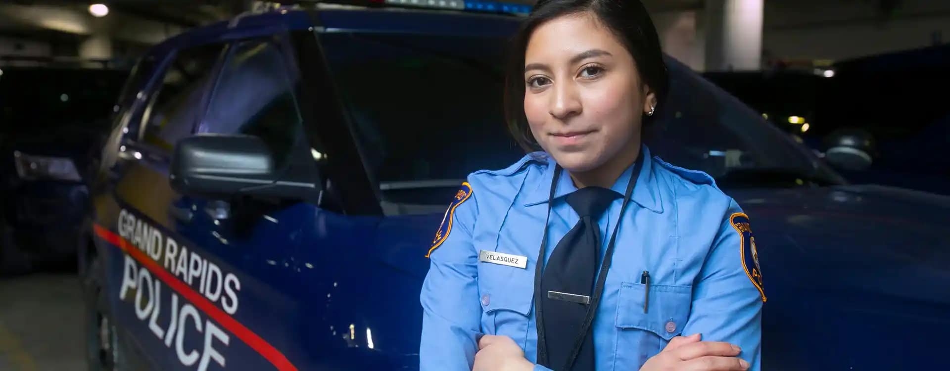 Journey-webheader-ServingHope police officer in front of cruiser