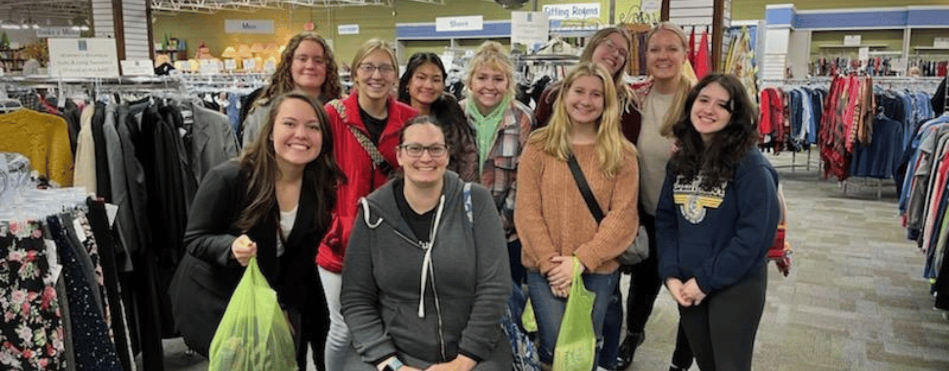 advising day header group of female students posing and smiling together