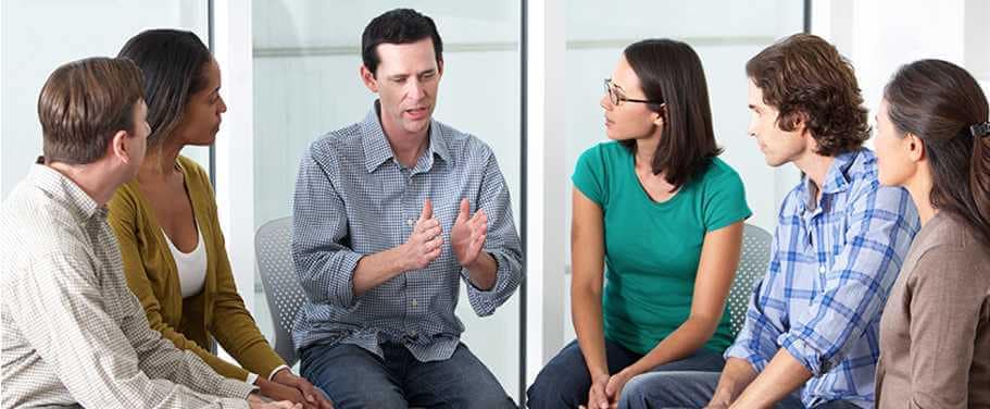 Picture Of man talking to students background image