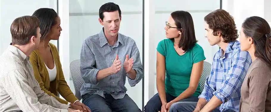 Picture Of man talking to students background image