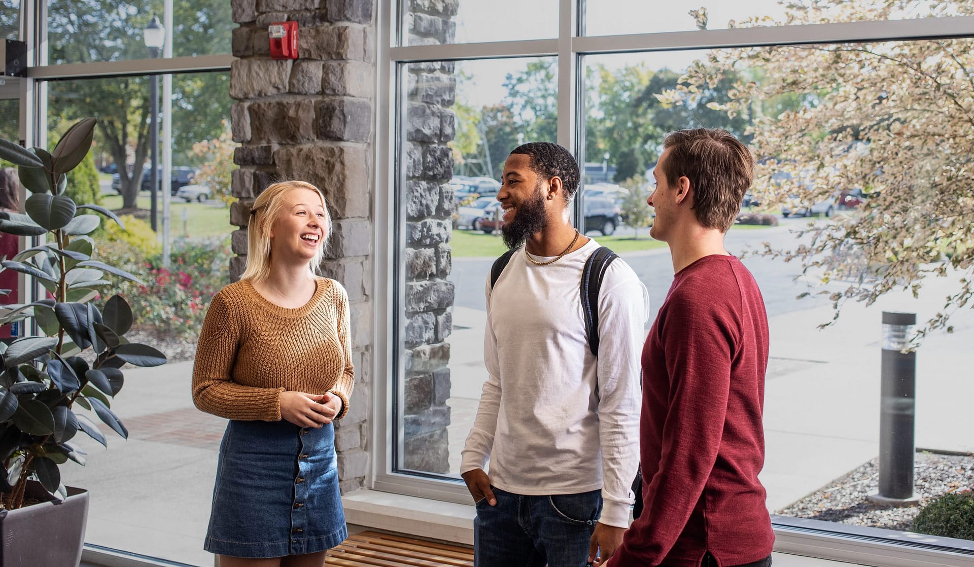 Fall2019_Grace_0140-edit Two students sitting by a window, reading the Bible.