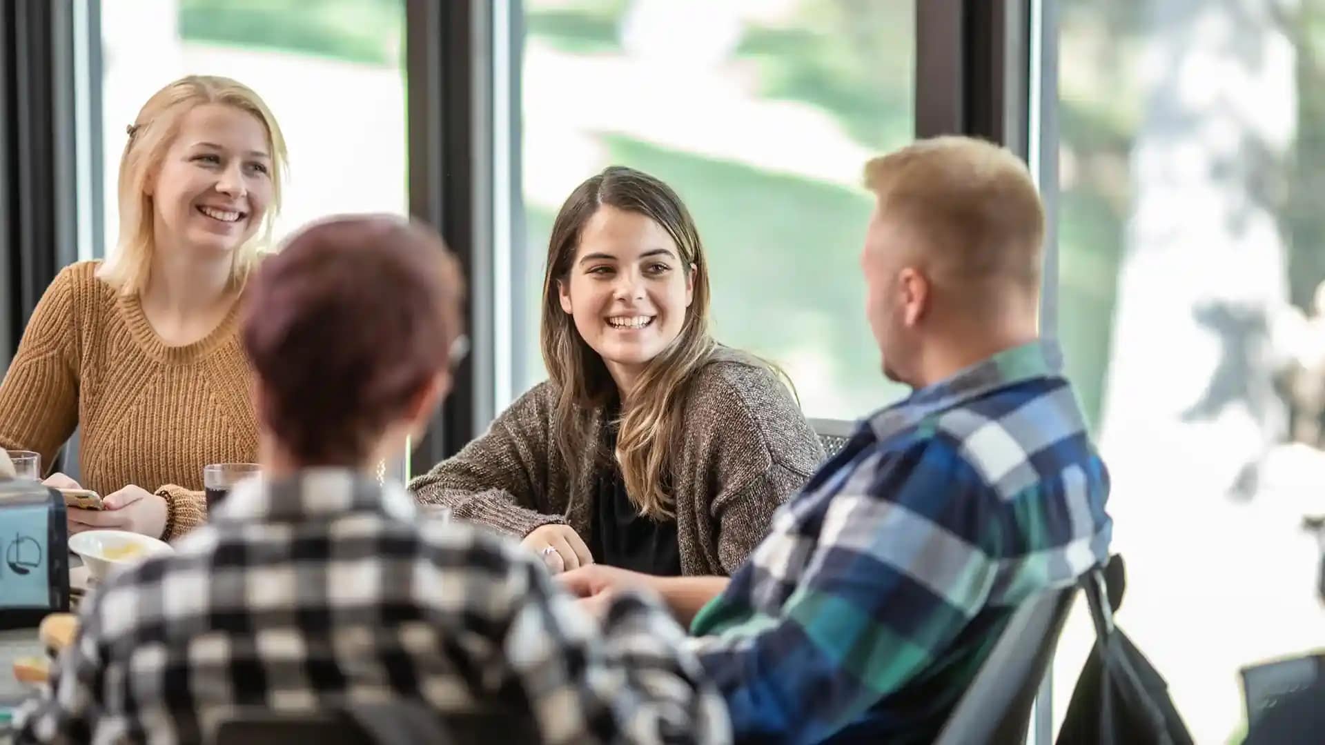 Fall2019_Grace_0148 A group of students reading and discussing the Bible