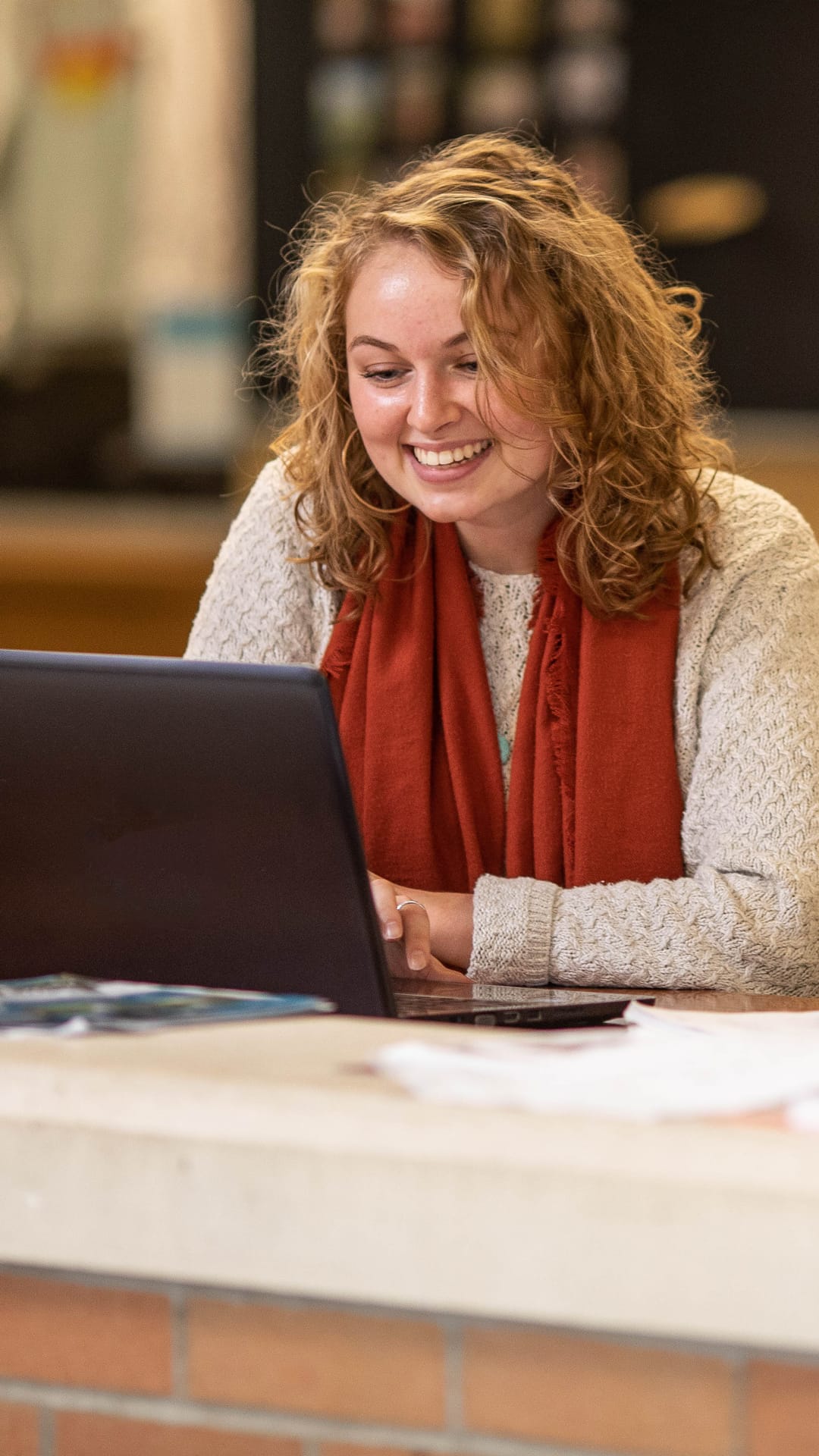 Grace Student working on a laptop