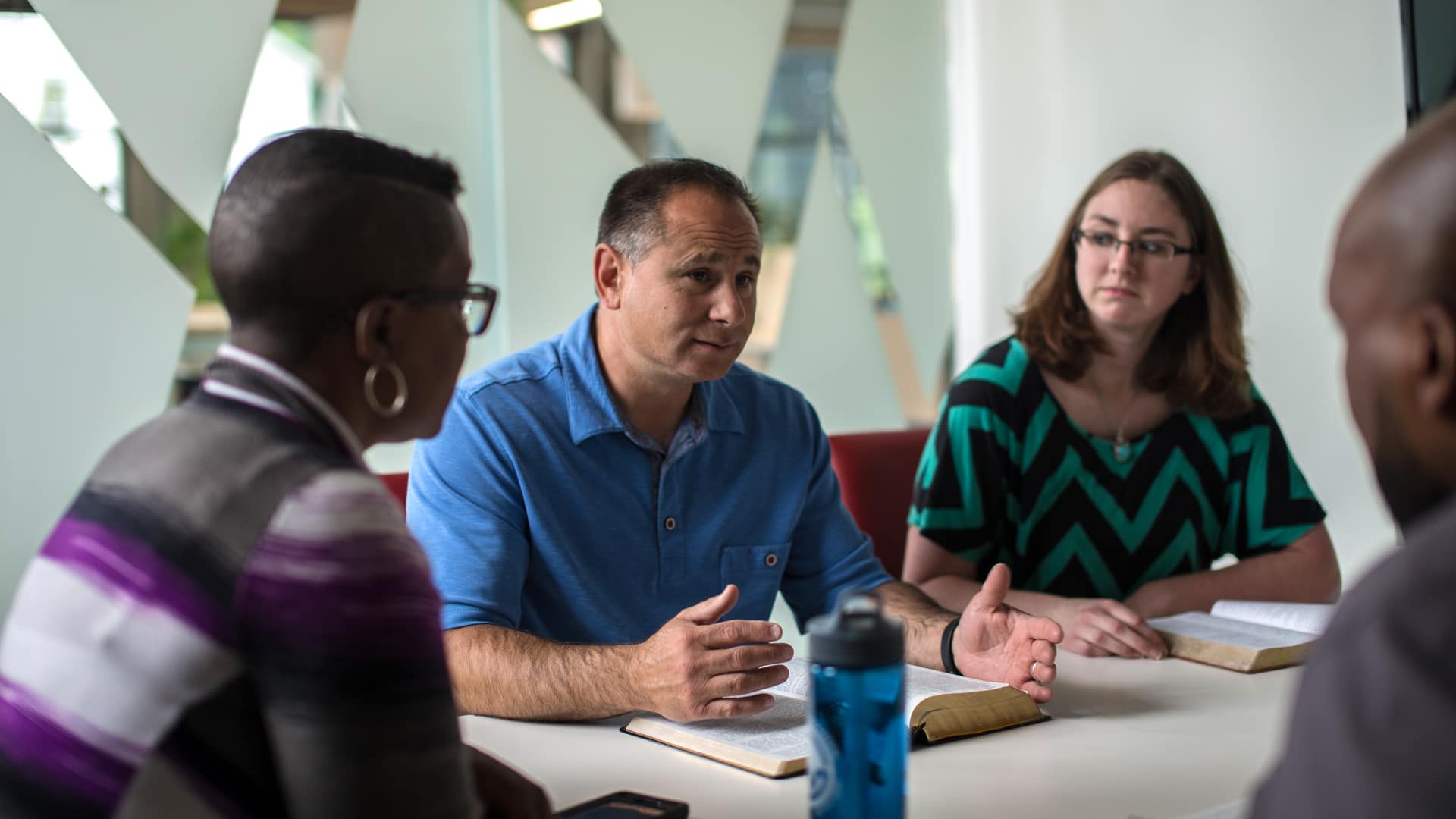 A group of Grace Students in a business meeting