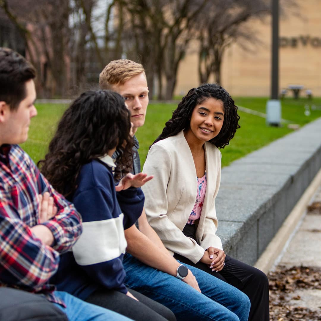 A group of Grace On-Campus students sitting outside in Grand Rapids, Michigan